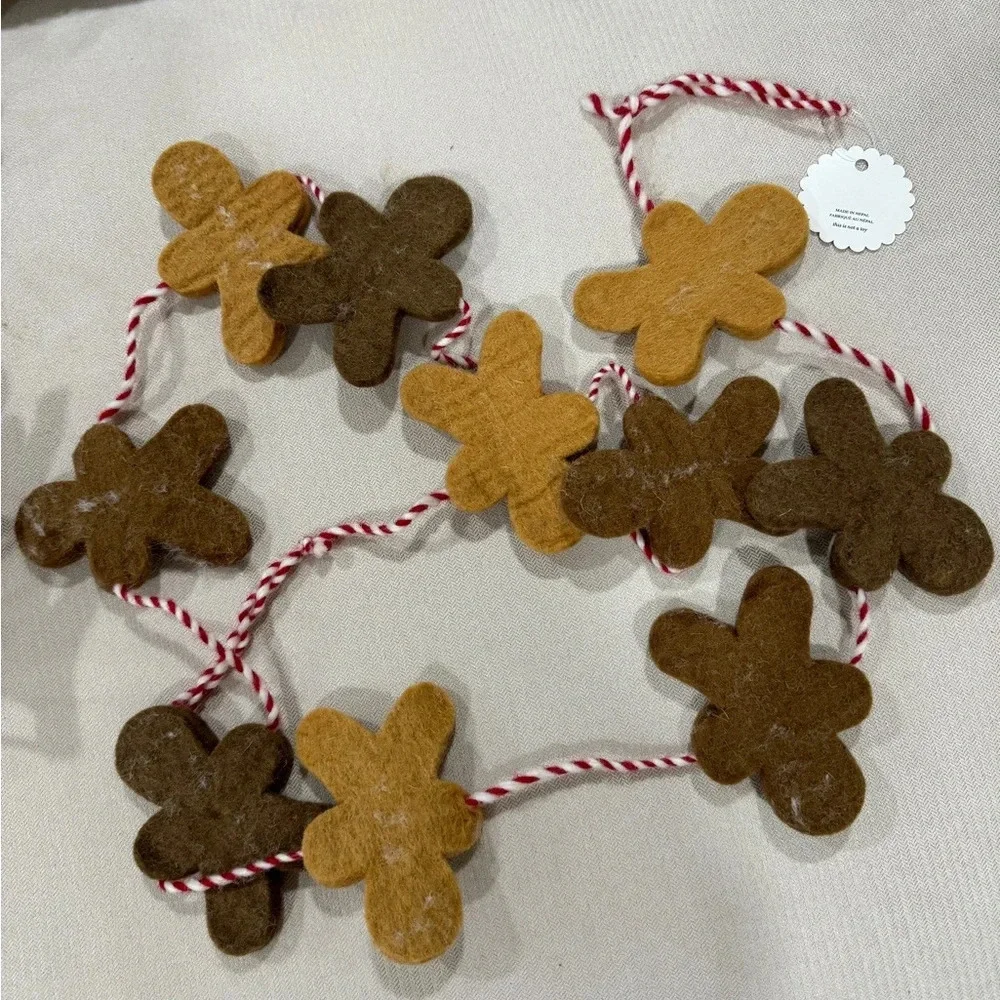 Anthropologie gingerbread men christmas garland wool decor holidays neutral home